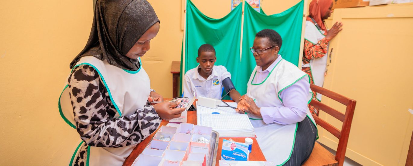 School nurses in sick bay treating student