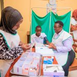 School nurses in sick bay treating student