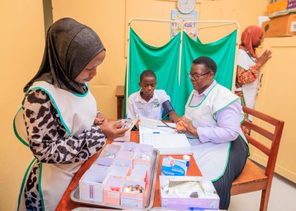 School nurses in sick bay treating student