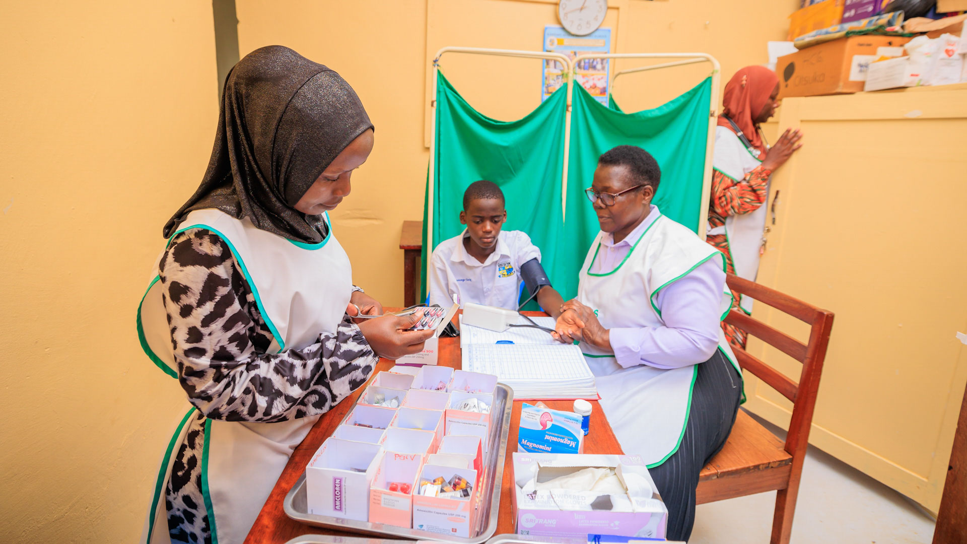 School nurses in sick bay treating student