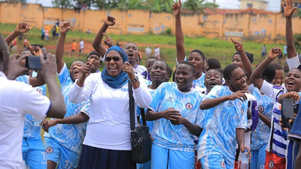 Girls team celebrating with Headteacher